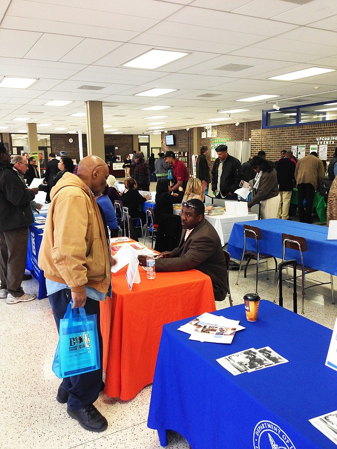 BAPC African Expo attendees visit vendor display tables to gather information.