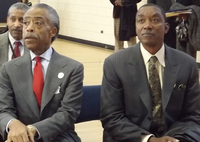 L-R: Civil Rights Leader and Radio/Television Talk Show Host, Rev. Al Sharpton sits next to former NBA star, Isiah Thomas, during a special assembly held last Thursday at Frazier Elementary School on Chicago's West Side.