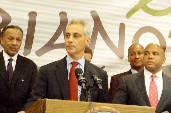 (L-R) Philip Johnson, principal with Johnson & Lee, Ltd., Chicago Mayor Rahm Emanuel, John Bonds, Safeway Construction (pictured in foreground) and 4th Ward Ald. Will Burns (standing next to Mayor Emanuel), got together last Wednesday to announce a new Mariano's grocery store will be built on vacant Chicago Housing Authority land at 39th and King Dr. with construction to start next year.