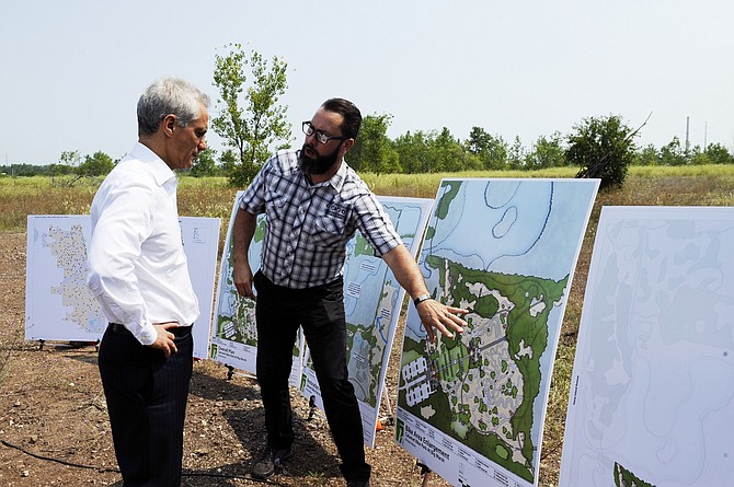 Chicago Mayor Rahm Emanuel, looks at a rendering for the planned Big Marsh Bike Trail.