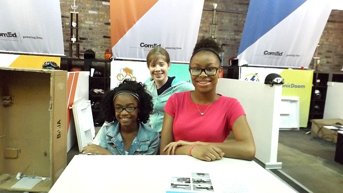 (L-R) Nakia Chappelle, 14, Jacquelyn Butler, 13, and Lauren Clay sit in the Icebox Car they are building with the help of mentor, Paula Corey, this summer as they participate in a collaborative initiative between ComEd,  the Girl Scouts of Greater Chicago and Northwest Indiana, Girls4Science and the Chicago Urban League, called The Icebox Derby, an educational competition where girls team up to build electric cars using recycled refrigerators and freezers over the course of six weeks as part of an effort to empower young women to explore opportunities in science, technology, engineering and math (STEM).