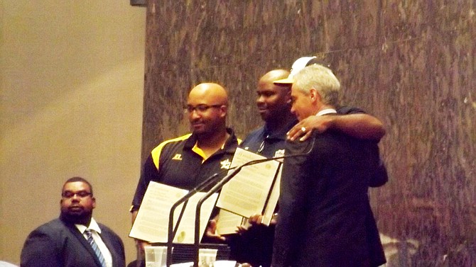 Chicago Mayor Rahm Emanuel poses for pictures with the coaches from the Jackie Robinson West All Stars during last week's Chicago City Council Meeting where the team was honored as Little League Baseball's 2014 World Series U.S. Champions.