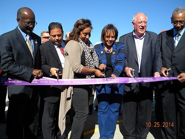 L-R Ill. Rep. Al Riley (Dist.-38), Ill. Rep. Robert “Bob” Rita (Dist.-28th); Ill. Sen. Toi Hutchinson (Dist. 40th); U.S. Rep., Robin Kelly (Dist.-2nd); Ill. Gov. Pat Quinn and U.S. Rep., Bobby Rush (Dist.-1st) take part in ribbon cutting ceremony on Sat., Oct. 25, 2014, for the official opening of the new, first-ever, interchange connecting I-57 and the Tri-State Tollway (I-294). 