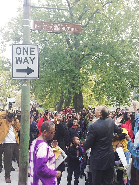 Ald. Michelle Harris (Dist.-8) (center) joined Institute of Positive Education founders at the unveiling of the organization’s honorary street sign Oct. 24, 2014 on the corner of 78th St. and Ellis Ave.   The the Institute of Positive Education (IPE), a community based non-profit organization that strives to provide quality education to community youth.