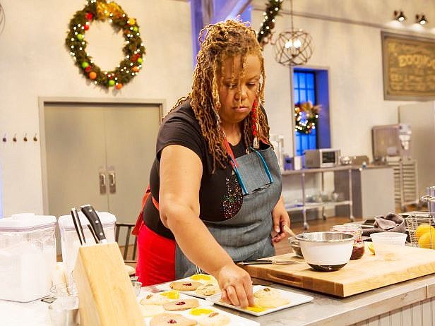 Stephanie Hart, owner of Brown Sugar Bakery, 328 E. 75th St., plates her cookies during the premiere of the Food Network's Holiday Baking Competition.