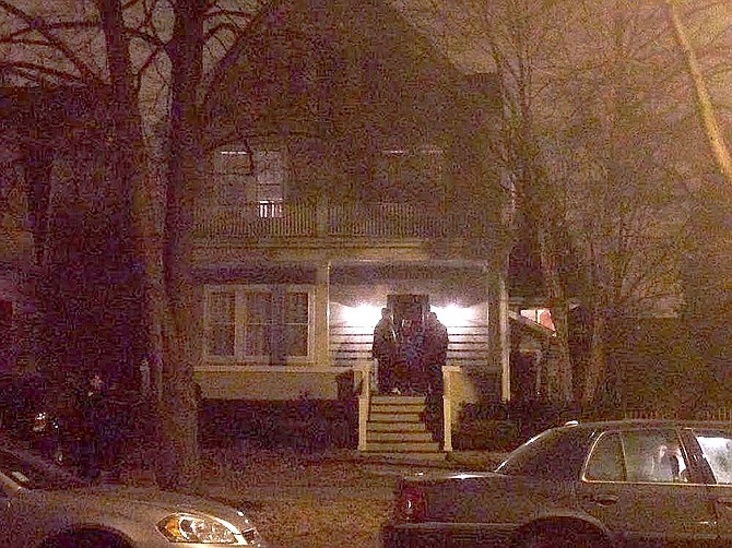 Police are shown on Mayor Rahm Emanuel's porch early last Saturday morning.