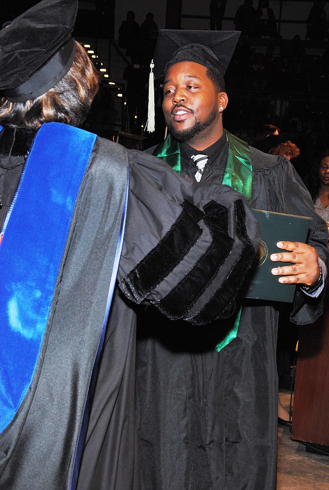 Martinez Sutton, brother of Rekia Boyd, 22, who was shot and killed by an off-duty Chicago Police detective, March 2012, graduates from Chicago State University last month with a Public Health Degree.