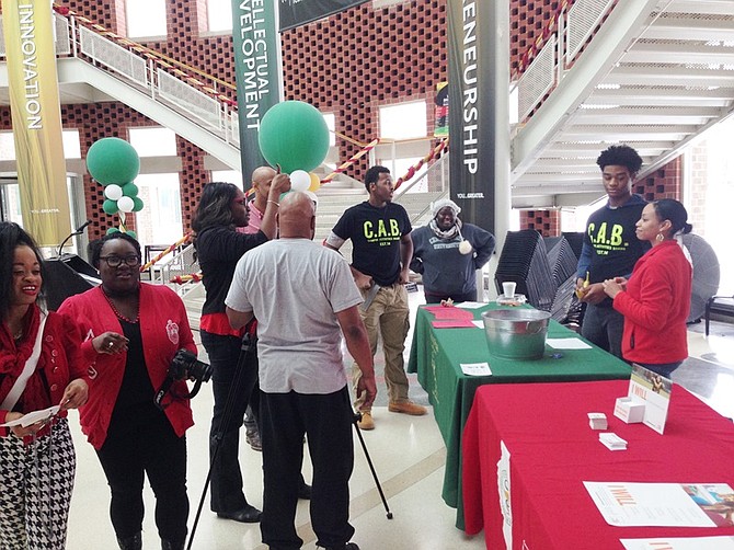 Chicago State University (CSU) students stopped by CSU's Student Government Association on-campus table to learn more about HIV/AIDS and the medication that manages it on the day before National Black HIV/AIDS Awareness Day.