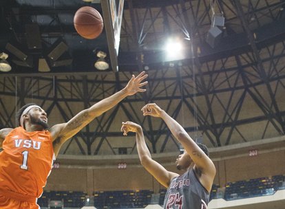 Virginia State University’s front line measures 6-foot-10, 6-foot-8 and 6-foot-8. The Trojans stand tall in the CIAA standings as well. ...