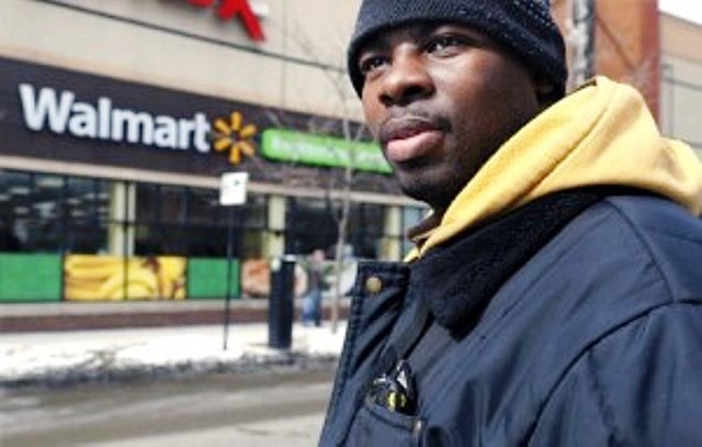 Richard Wilson, 27, stands outside a Wal-Mart in Chicago. At the time the photograph was taken in March 2014, he was earning $9.25 an hour.