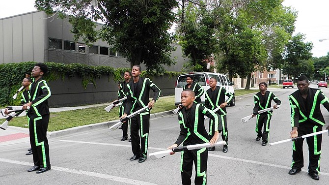 South Shore Drill Team members practice before taking part in the Chicago west side parade.