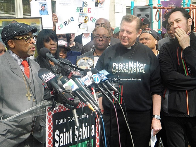 L-R Academy Award nominated director Spike Lee, Faith Community of St. Sabina Pastor Father Michael Pfleger, and actor John Cusack gathered alongside several Englewood community stakeholders in support of Lee's upcoming film, "Chiraq" at St. Sabina, 1210 W. 78th Pl.