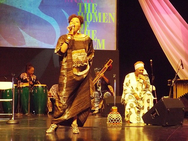 Rita Warford, of the Women of the Association for the Advancement of Creative Musicians (AACM) takes center stage Friday night at the DuSable Museum during a concert that celebrates the group’s 50th year anniversary. Back row L-R, Coco Elysses on congos, Shanta Nurullas plays sistar while Sherry Scott (seated), uses her voice as a musical instrument.