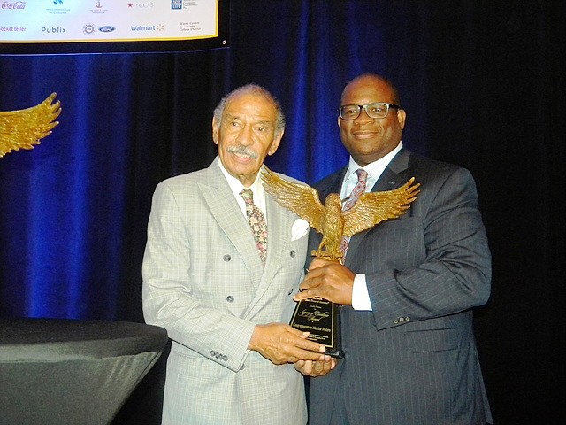 U.S. Congressman John Conyers, Jr. (MI-13th) was presented the National Newspaper Publishers Association (NNPA) Legacy of Excellence Award by Hiram Jackson, CEO,  Real Times Media at the NNPA 75th Annual National Convention at the Detroit Marriott at the Renaissance Center, 400 Renaissance Dr., Detroit, MI.