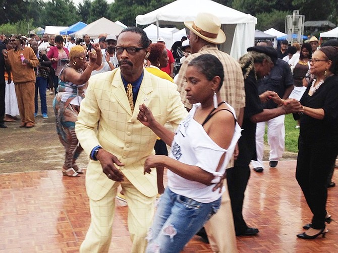 Denise Sherman dances with Ron Wilkens at the DuSable festival. 