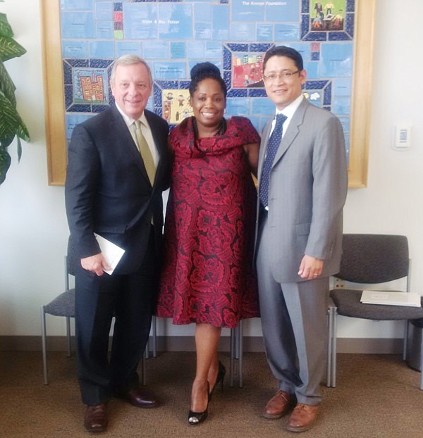 U.S. Senator Dick Durbin stands with Metropolitan Family Services Calumet Center, Executive Director Audrena Spence and President and CEO Ric Estrada.