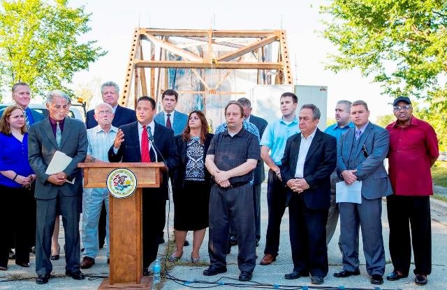 Ill. State Rep Bob Rita (Dist.-28th) and Blue Island Mayor Domingo Vargas, along with several other officials, announce plans for the Division Street Bridge in Blue Island, IL.