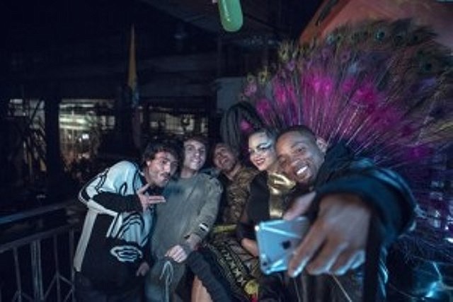 In this Sept. 17, 2015 photo released by Sony Music, members of Bomba Estereo, from left, Simon Mejia, Julian Salazar, Andres Zea and Liliana Saumet pose for a selfie with actor-singer Will Smith, who appears on a remix to Colombian band Bomba Estereos song, Fiesta.