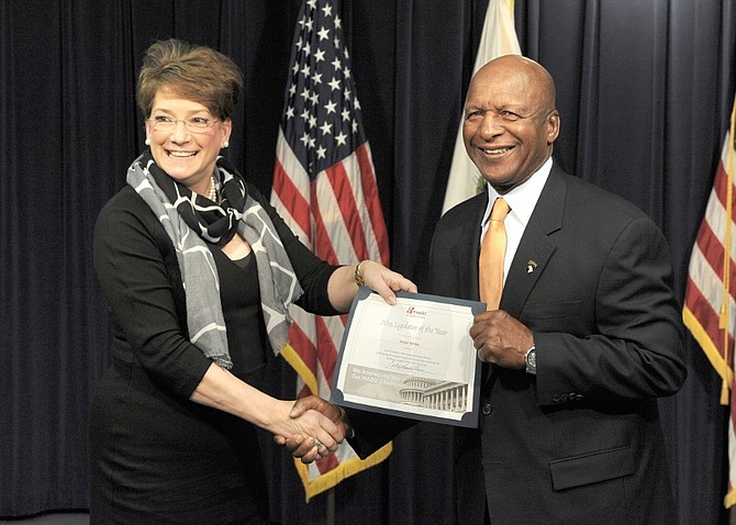 Illinois Secretary of State Jesse White is pictured with Mothers Against Drunk Driving (MADD) National President Colleen Sheehey-Church as he receives the organization’s 2015 Legislative Champion award on November 24, 2015.