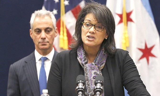Sharon Fairley, Chief Administrator, Independent Police Review Authority (IPRA) speaks during a press conference on reforming her office as Chicago Mayor Rahm Emanuel listens in.