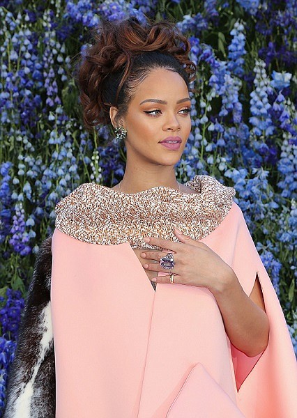 In this Friday, Oct. 2, 2015, file photo, singer Rihanna poses before Christian Dior’s Spring-Summer 2016 ready-to-wear fashion collection to be presented during the Paris Fashion Week, in Paris.