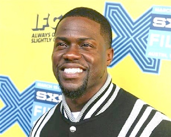 In this March 16, 2015 file photo, Kevin Hart arrives for the world premiere of "Get Hard" during the South by Southwest Film Festival in Austin, Texas. Hart is going to go undercover as a Lyft driver in an original series being made by Hart’s production company and studio Lionsgate. The show will be made available online through a video on demand service called Laugh Out Loud. 
