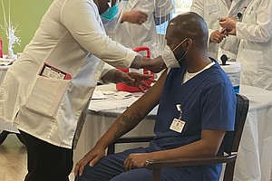 Staff and residents at Symphony of Joliet, a long-term care facility on Larkin Avenue, have started receiving the Pfizer COVID vaccine.