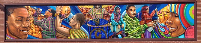 Artist Rahmaan Statik created the mural at Garrett’s Popcorn, located 757 E. 87th St. Photo provided by Rahmaan Statik.