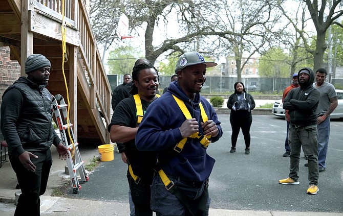 Participants complete harness training to install solar panels at heights. PRNewsfoto/Summit Ridge Energy.
