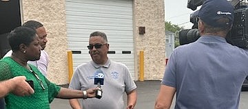 Rich Township Supervisor Calvin Jordan speaks to the media concerning the recent cuts in the federal food program that has led to increased traffic at the Rich Township Pantry. Photo provided by STH Media LLC