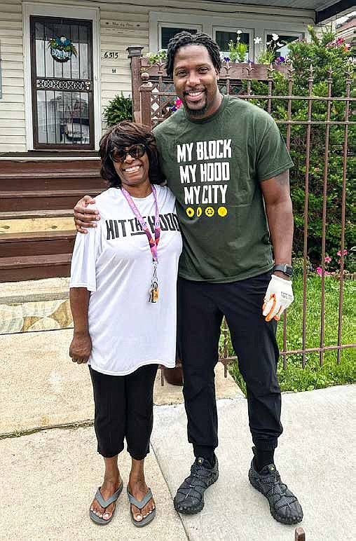 Jahmal Cole, founder of My Block My Hood My City, with a community member. Cole and the organization have been providing food for seniors through its Senior Food Program. PHOTO PROVIDED BY MY BLOCK MY HOOD MY CITY.