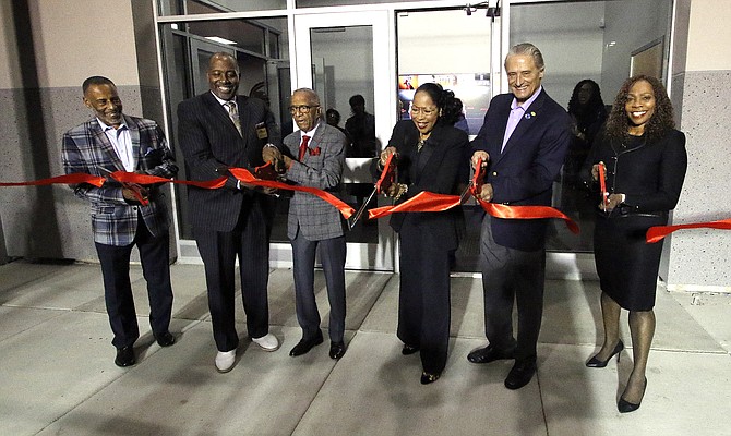 From left, University Park mayor Joseph Roudez III, Park Forest mayor Joseph A. Woods, Matteson School District 162 and Southland College Prep Board President
Ron Bean, Matteson School District 162 Superintendent Dr. Blondean Y. Davis, Richton Park mayor Rick Reinbold and Matteson mayor Sheila Chalmers-Currin cut the ribbon for District 162’s new multi-purpose building. PHOTO PROVIDED BY MATTESON SCHOOL DISTRICT 162.