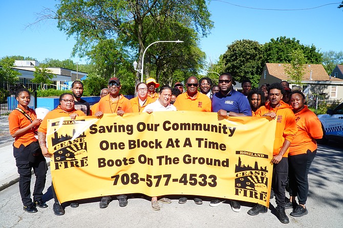 members of Cease Fire led by (CENTER OF BANNER) Cease Fire CEO Bob Jackson, State Representative Robert Rita, and 21st Ward Alderman