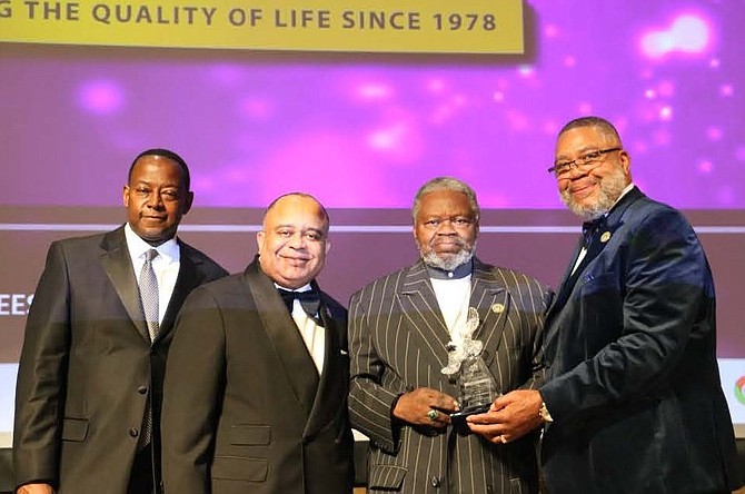 Second from right, Rev. Dr. Albert R. Sampson, senior pastor, Fernwood 
United Methodist Church, accepts his award, from, left to right, HSI board 
chair Melvin L. Brooks, Esq, HSI Fundraising Board Chair Jamil Muhammad,
Sampson, and HSI President and CEO Donald Dew.