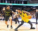 VCU's Zeb Jackson (2) gets past George Mason's K. D. Johnson (0) as the VCU Rams defeat the George Mason Patriots (70-54) at the Siegel Center Saturday, Feb. 22, 2025.  (photo by James Haskins)