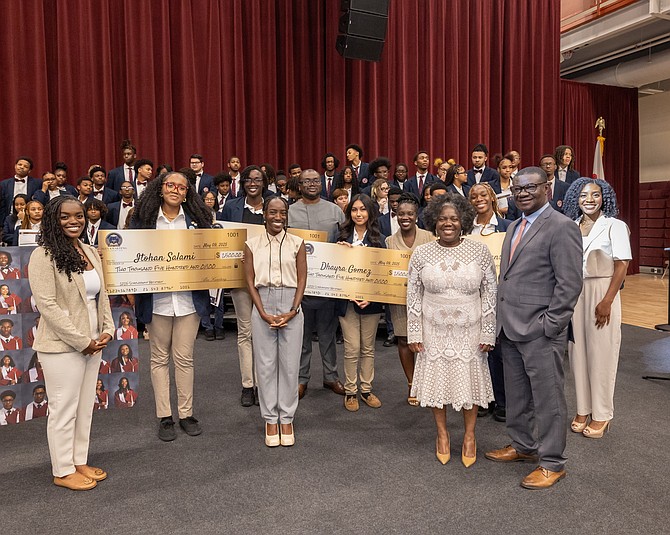 The Kwarteng sisters – Amy, Esther, Lisa and Sandra -- with their mother, Stella, and their father, Dr. Alex Kwarteng during the announcement of scholarship recipients at Southland College Prep Charter High School. Photo provided by Southland College Prep Charter High School.