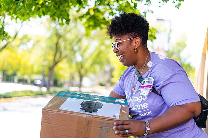 Shanice Williams is the OB Program Manager, Section Administrator OB/GYN at UChicago Medicine Ingalls Memorial Hospital, giving out free car seats during the hospital’s 2024 Drive-Thru Baby Shower. Photo provided by UChicago Medicine Ingalls Memorial Hospital.