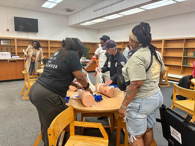 During the Chicago Department of Public Health Gun Safety Workshops people can receive training on Stop the Bleed and receive gun locks. Photo provided by CDPH.