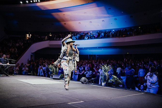 Jordan G. Welch leading worship at Jackie Hill Perry's Glory Conference 2023, held at Destiny Church at Capitol in Sacramento, California.