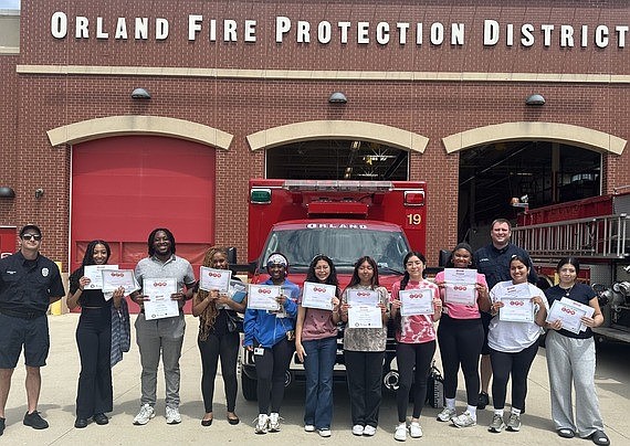 Student interns from Cook County Department of Public Health's Community Health Worker High School Pipeline Program showcase their certificates after completing CPR training.
