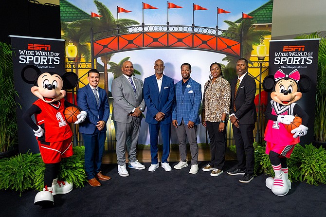 Mickey Mouse, Minnie Mouse and ESPN Wide World of Sports Complex General Manager LeRoy Arrington celebrate with coaches and representatives from Historically Black Colleges and Universities after the announcement of the new HBCU Hoops Invitational coming to Walt Disney World Resort in Florida. The new event, featuring men's and women's college basketball teams from HBCU programs is Dec. 4-7 at ESPN Wide World of Sports Complex. (Bennett Stoops)