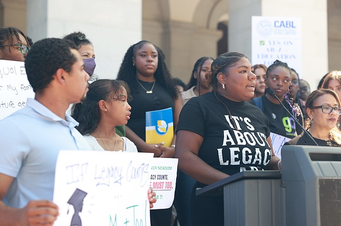 Kristin Nimmers, Policy Manager with the California Black Power Network, speaks to a crowd of supporters at the State Capitol. California Black Power Network