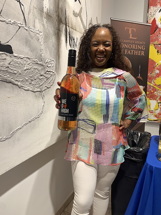 Chrishon Lampley, owner of Love Cork Screw, did a wine tasting at the Village Legal and Community Project fundraising gala. Photo by Tia Carol Jones.