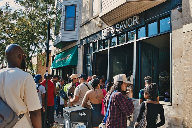 During the MALIKSHOTYOU ArtWalk in Bronzeville participants were encouraged to support local Black owned businesses. Photo by Gerard Ortiz & Brittany Banko: VYBE Media.