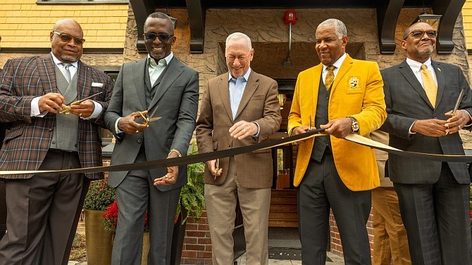 Dedicating the House of Alpha Leadership Institute on Oct. 18 are, left to right, Alpha Light Foundation board members Roger Bailey ’86 and Nigel Telman ’86; President Michael I. Kotlikoff (center); Robert F. Smith ’85 (center right), founder, chairman and CEO of Vista Equity Partners; and Dr. Dennis Mitchell ’84 (far right), founding president of Alpha Light Fund. Credit: Jason Koski/Cornell University