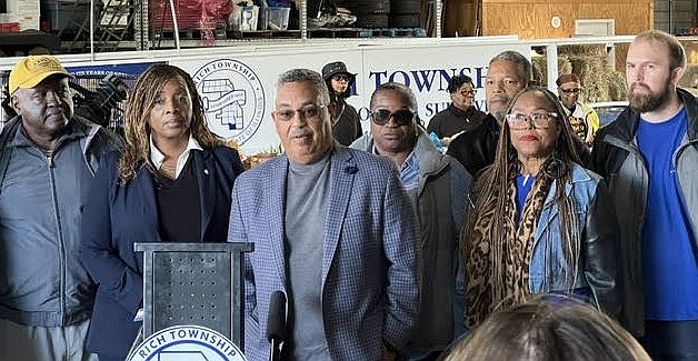 Rich Township Supervisor Calvin Jordan and Cook County Commissioner Dr. Kisha McCaskill address the media just ahead of the food distribution at the Rich Township Pantry. (Photo courtesy of STH-Media)