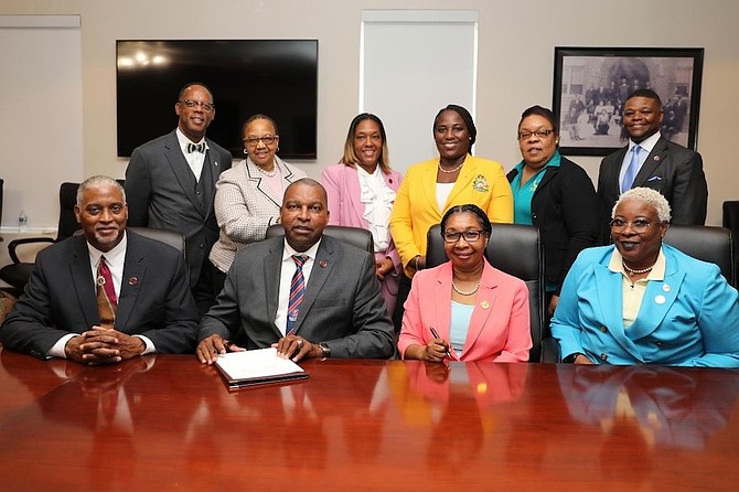 Surrounded by officials from the university and the Bahamas, SC President Alexander Conyers signs the Program Specific Agreement. BlackPRWire.