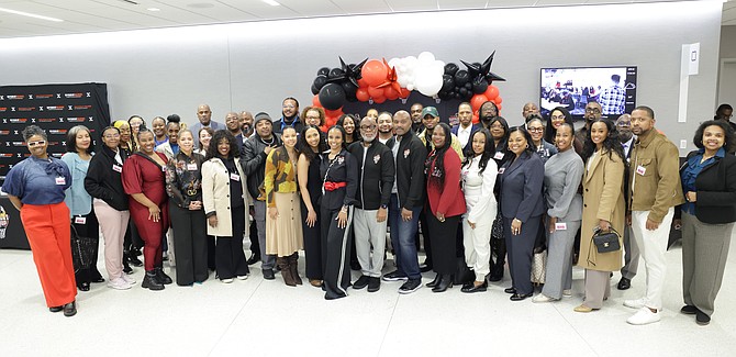 The Support Group Founders Tim Hardaway, Sr. and Bennie Henry, with the leaders from Lunch with a Leader event. Photo provided by With An Eye PR.