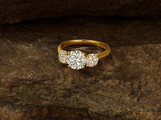 Desert diamonds bridal campaign 3stone ring /PRNewswire