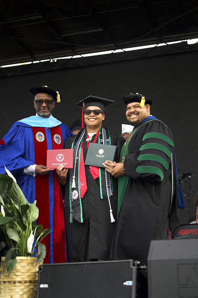 Pictured from left to right : (Left )Dr. Johnnie Thomas- Superintendent of RTHS 227 (Center) RTHS Graduate Queen Thigpen (Right) Dr. Michael Anthony -President of Prairie State College
